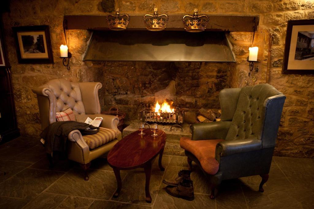 The Three Crowns Hotel Чагфорд Екстериор снимка The fireplace in the bar